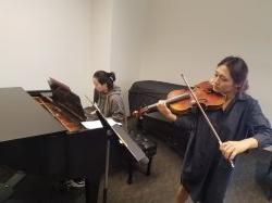 Violin and piano students practicing