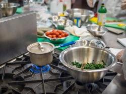 Photo of pot on stove in cooking lab.