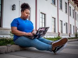 Student sitting on a laptop